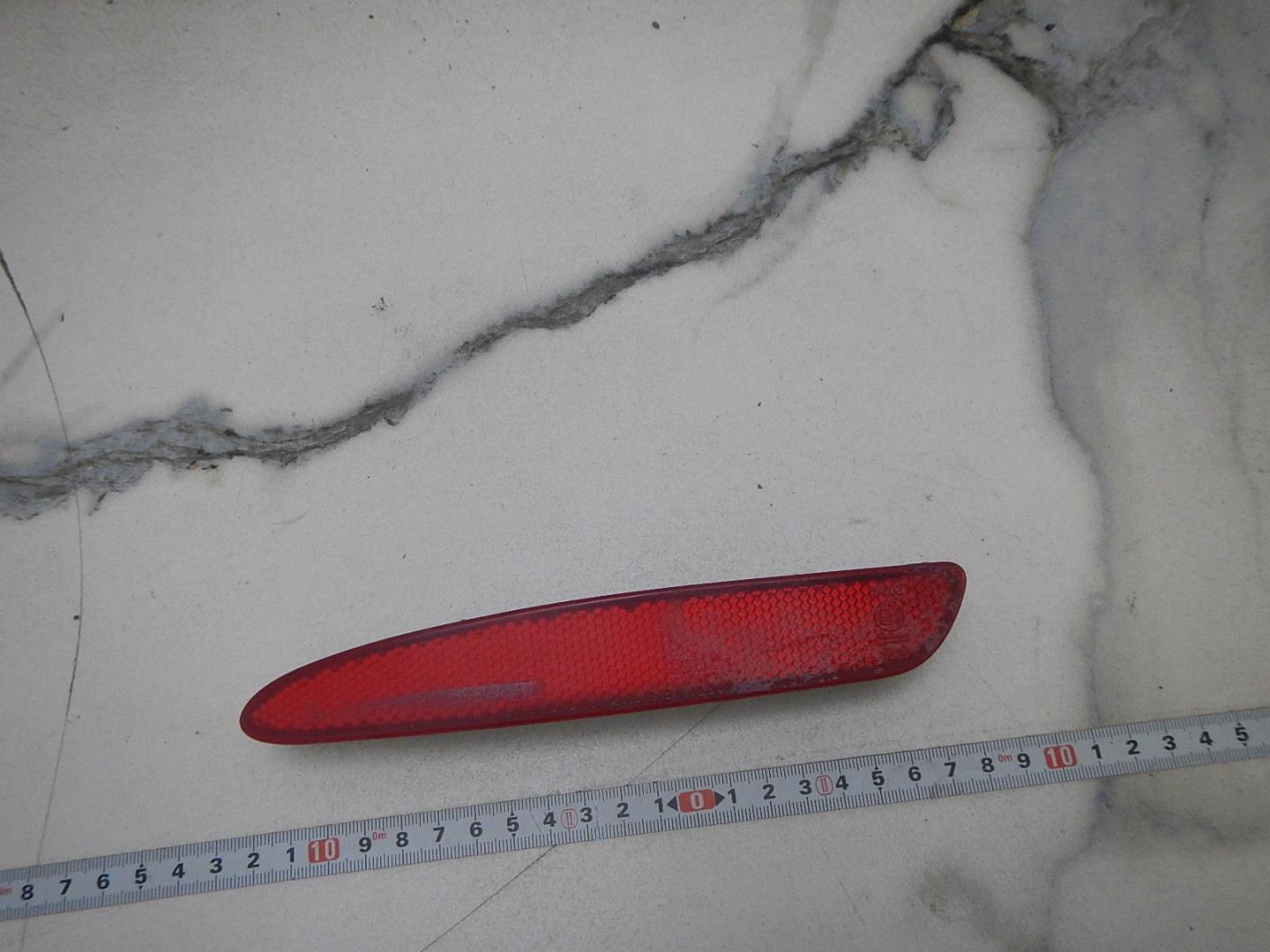 Отражатель в бампер задний левый