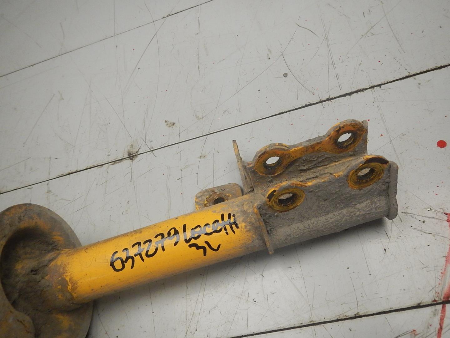 Амортизатор задний левый