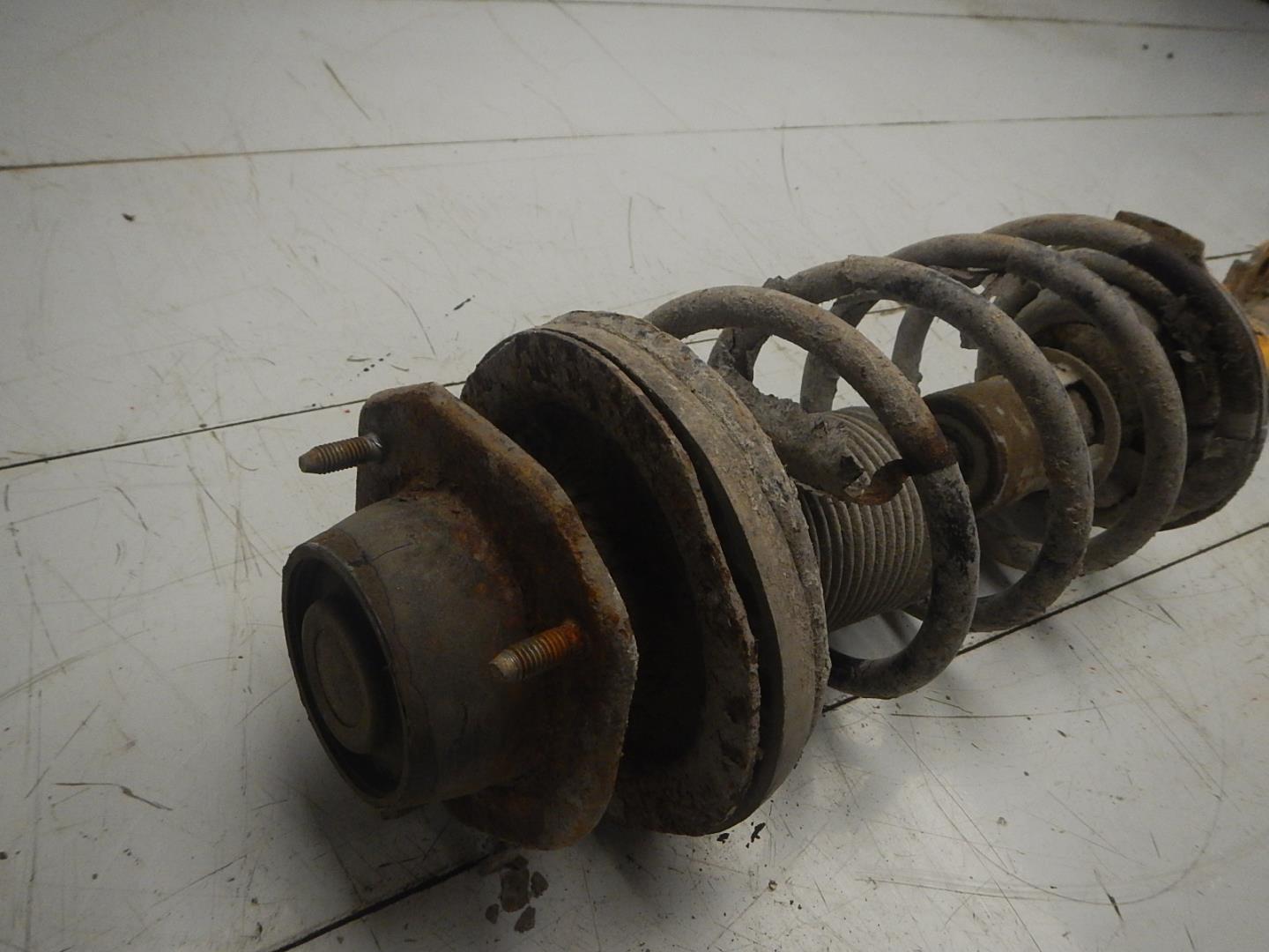 Амортизатор задний левый