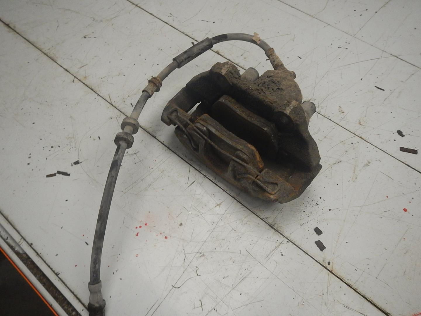 Суппорт передний левый