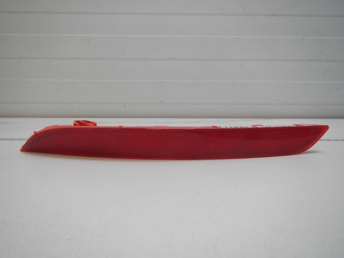 Отражатель в бампер задний левый