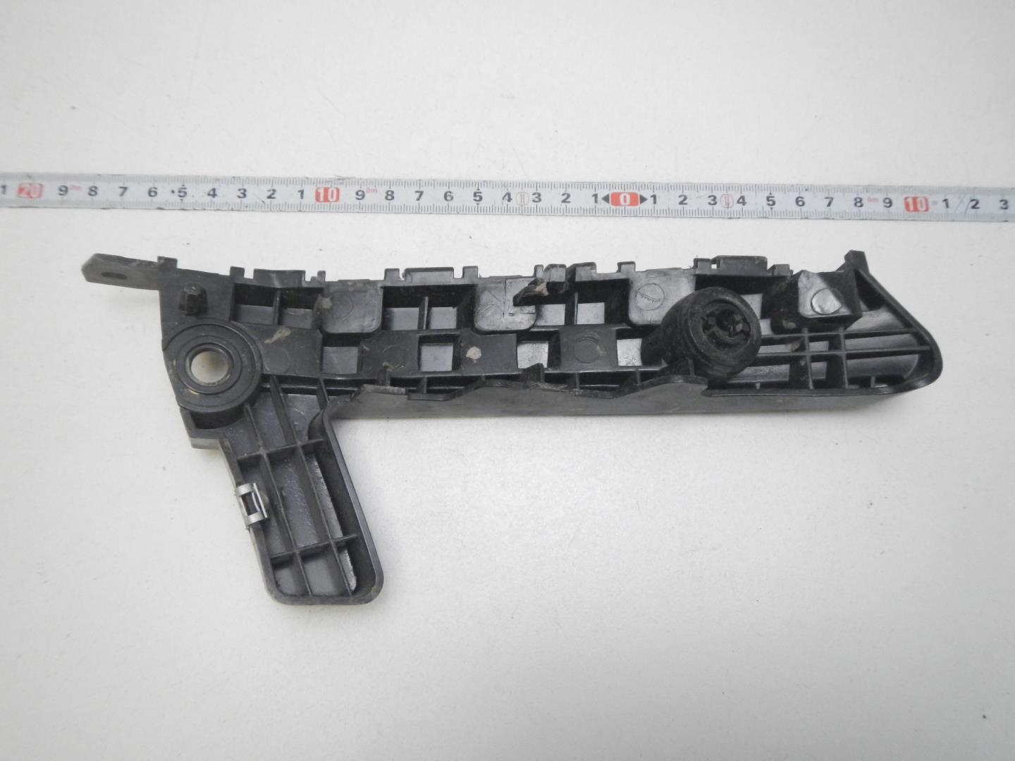 Кронштейн переднего бампера левый