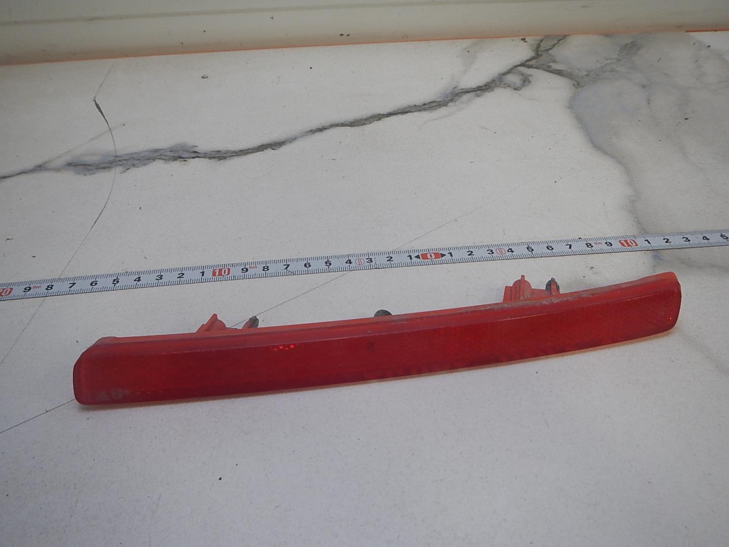 Отражатель в бампер задний левый