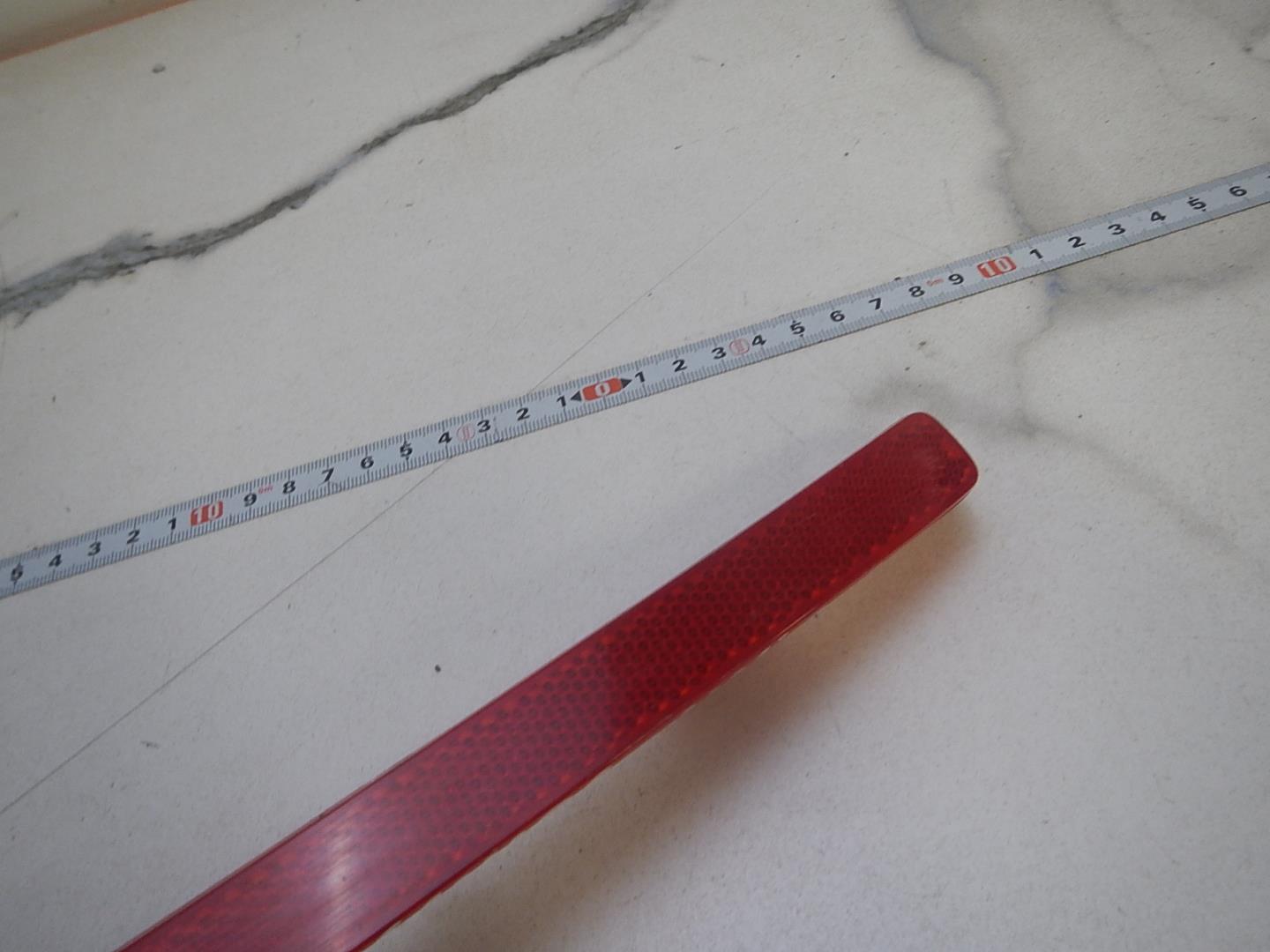 Отражатель в бампер задний левый