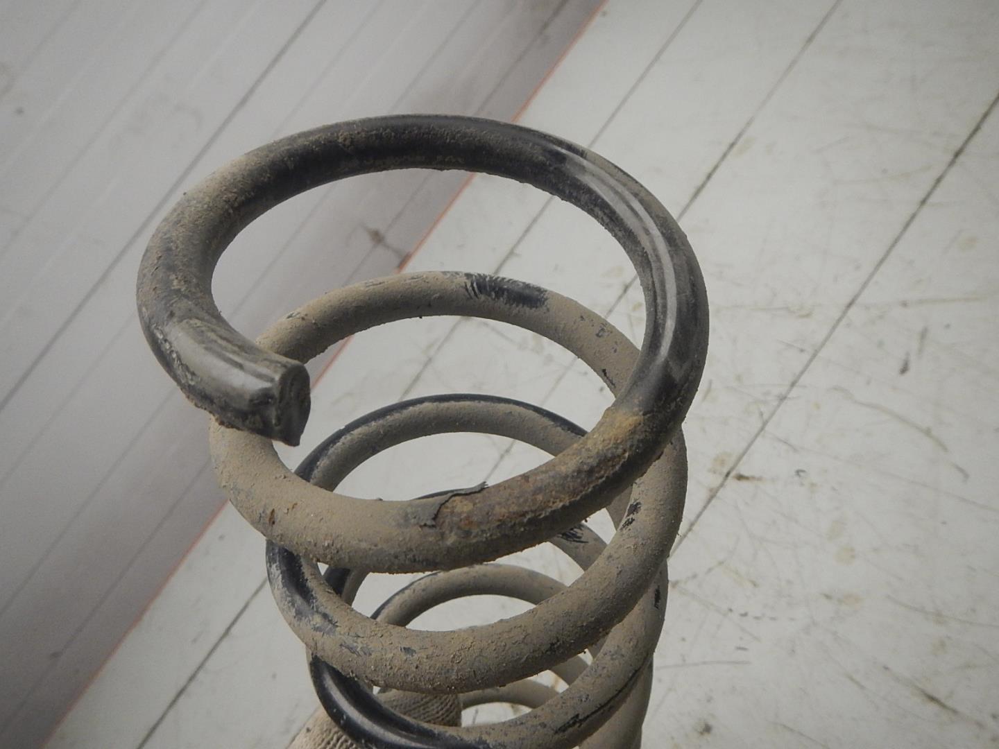 Пружина задняя