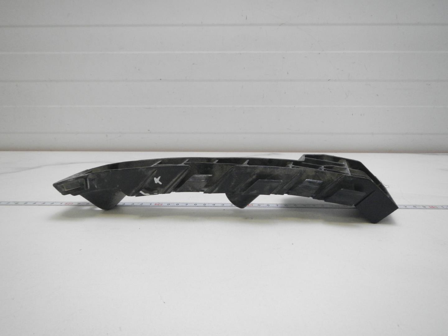 Кронштейн переднего бампера левый