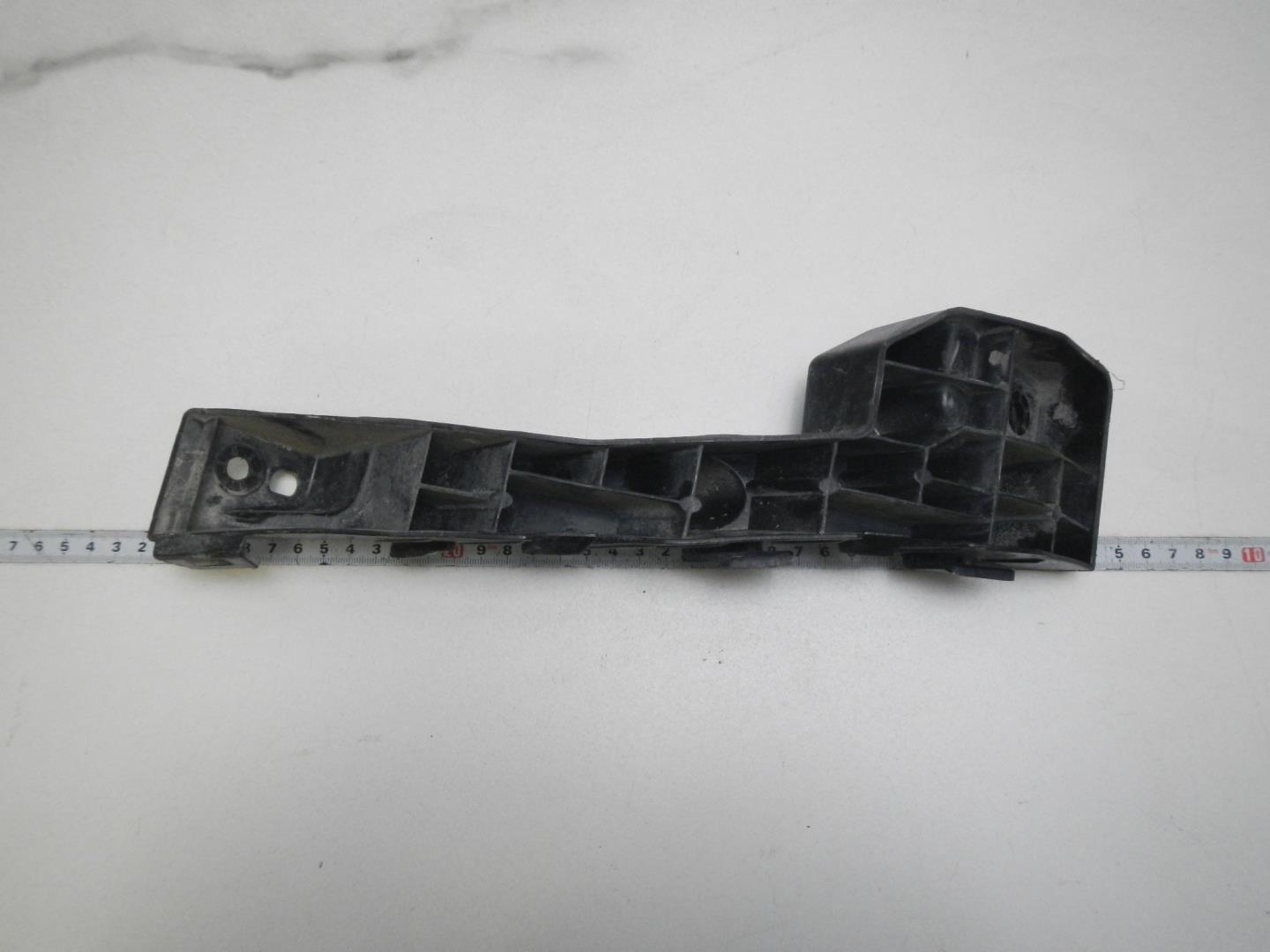 Кронштейн переднего бампера левый