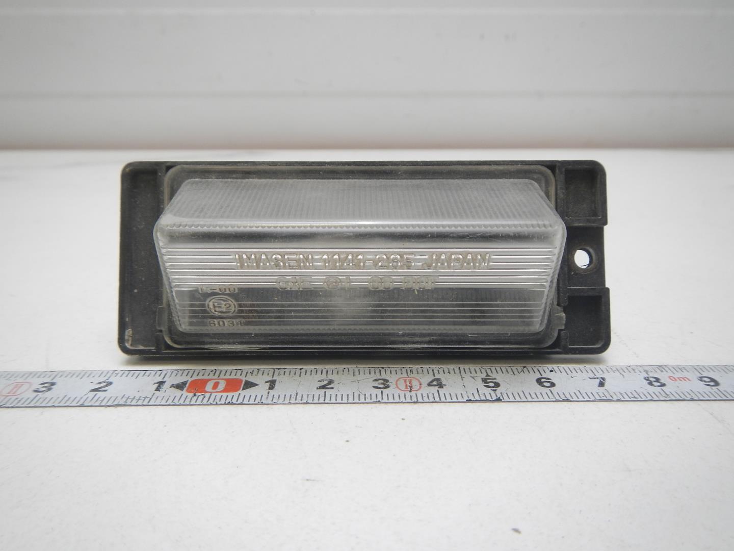 Фонарь подсветки номера