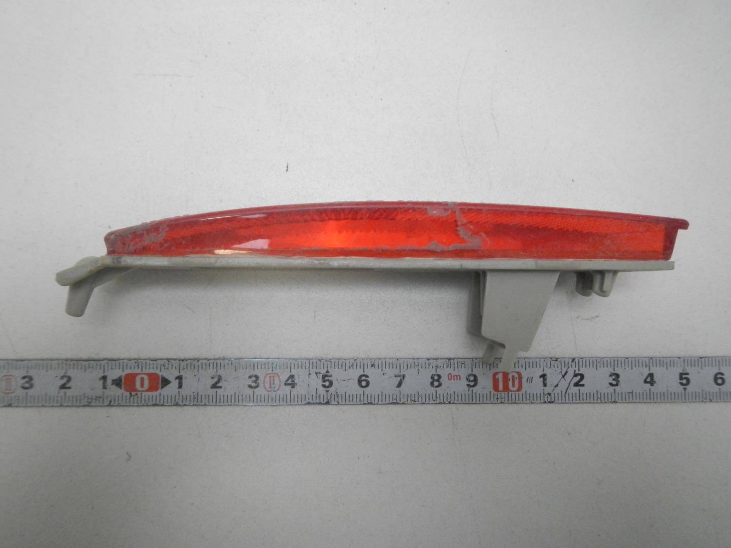 Отражатель в бампер задний левый