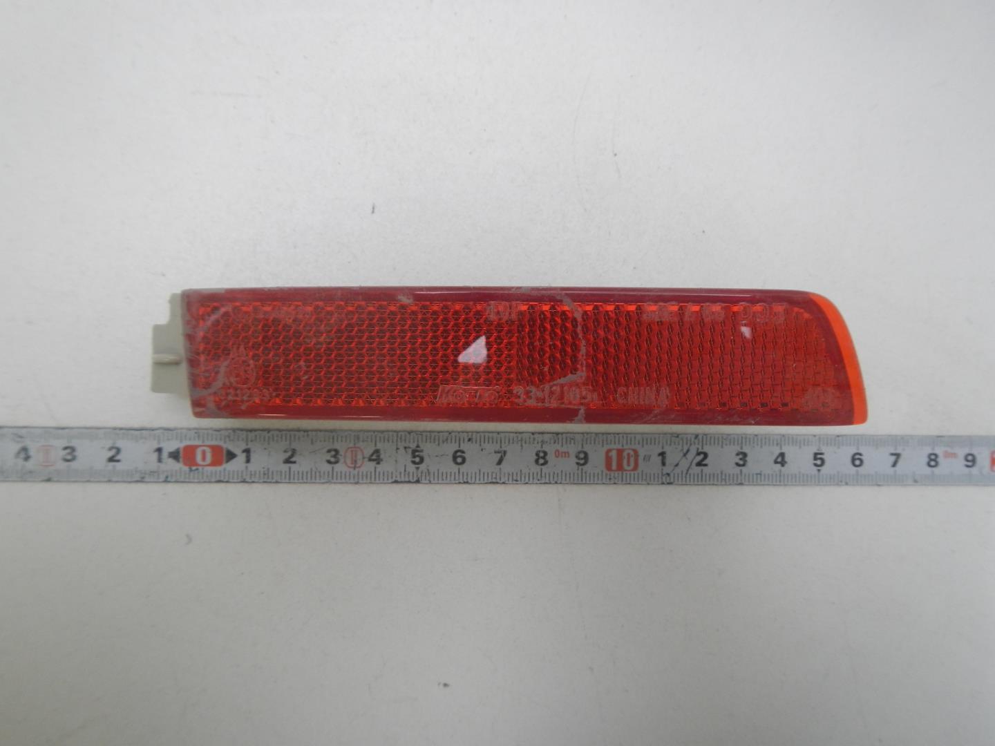 Отражатель в бампер задний левый