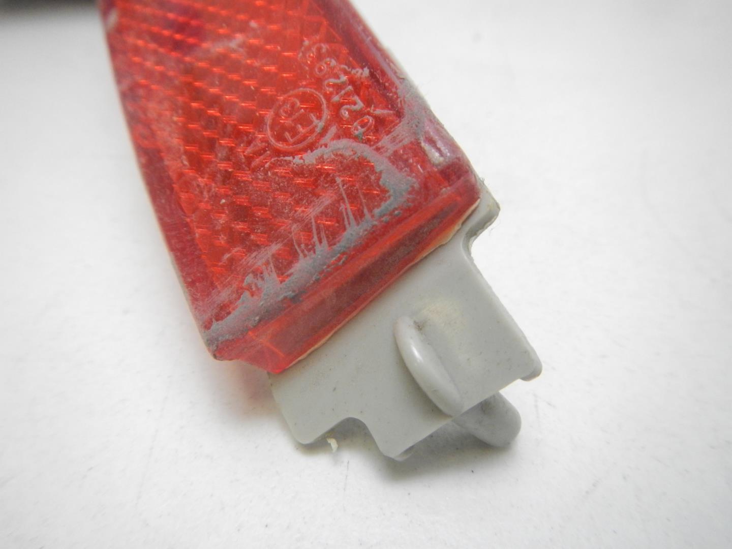 Отражатель в бампер задний левый