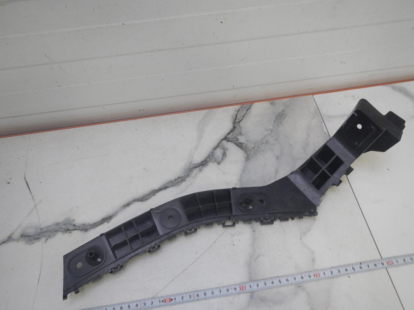 Кронштейн заднего бампера левый