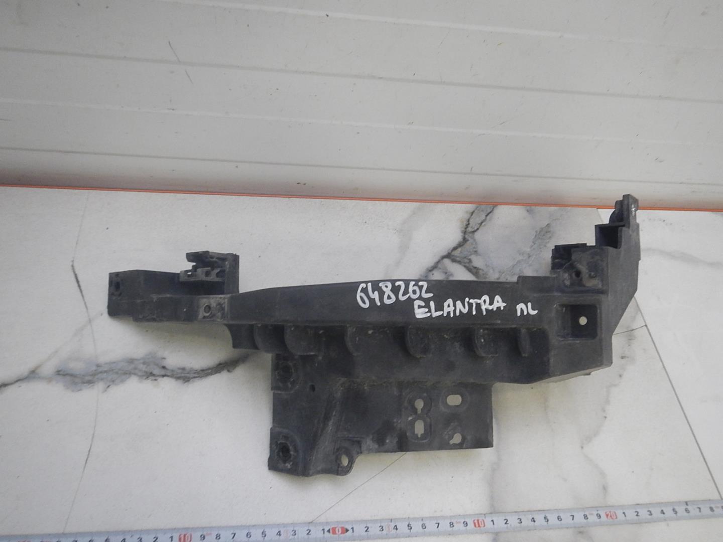 Кронштейн фар левый