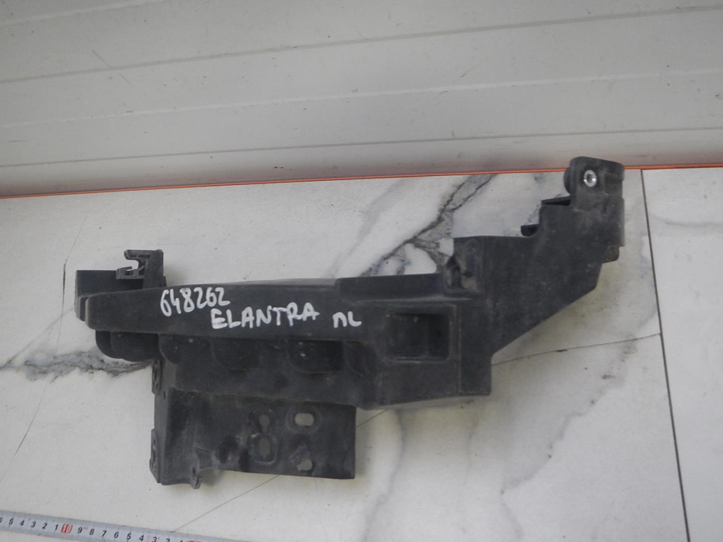 Кронштейн фар левый