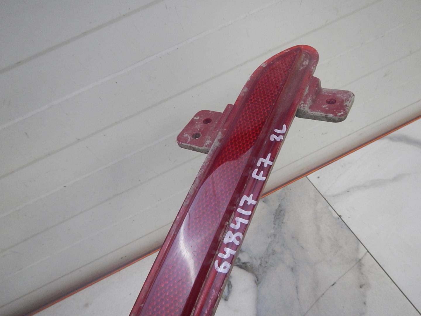 Отражатель в бампер задний левый