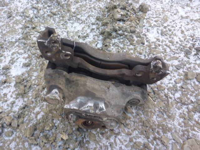 Суппорт задний левый