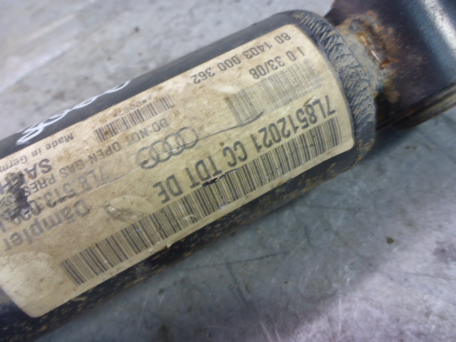 Амортизатор задний левый