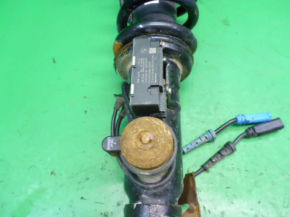 Амортизатор передний левый