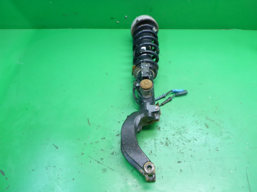 Амортизатор передний левый