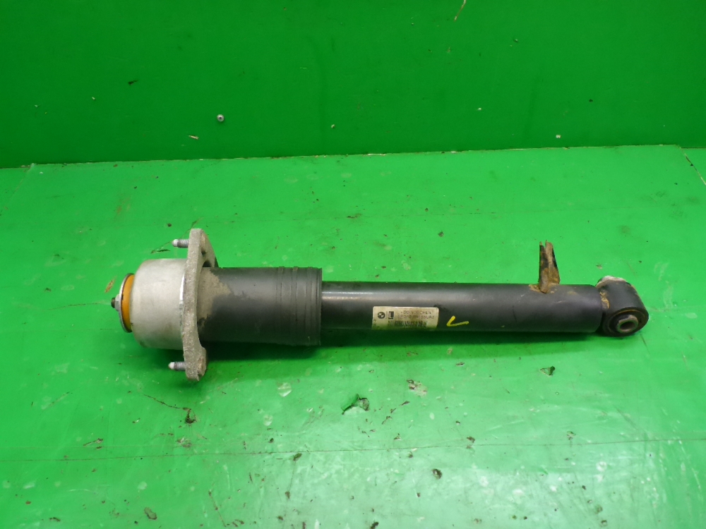 Амортизатор задний левый