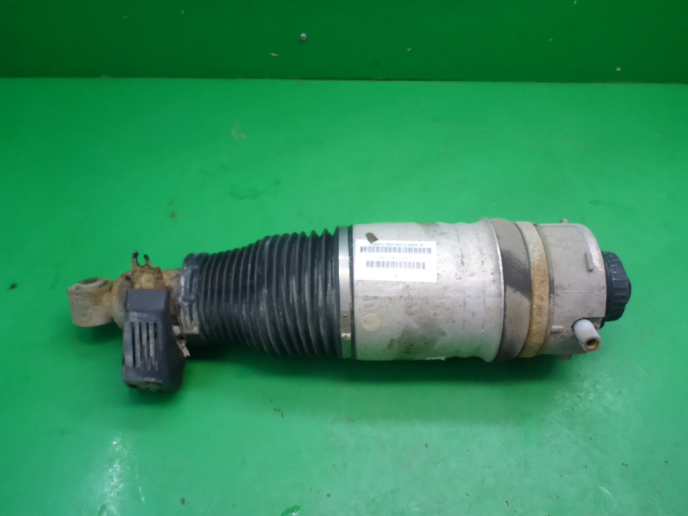 Амортизатор задний левый