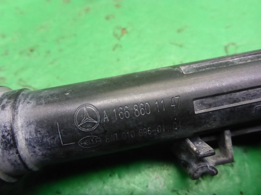 Форсунка омывателя фары