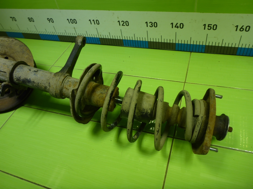 Амортизатор передний левый