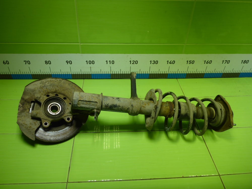 Амортизатор передний левый