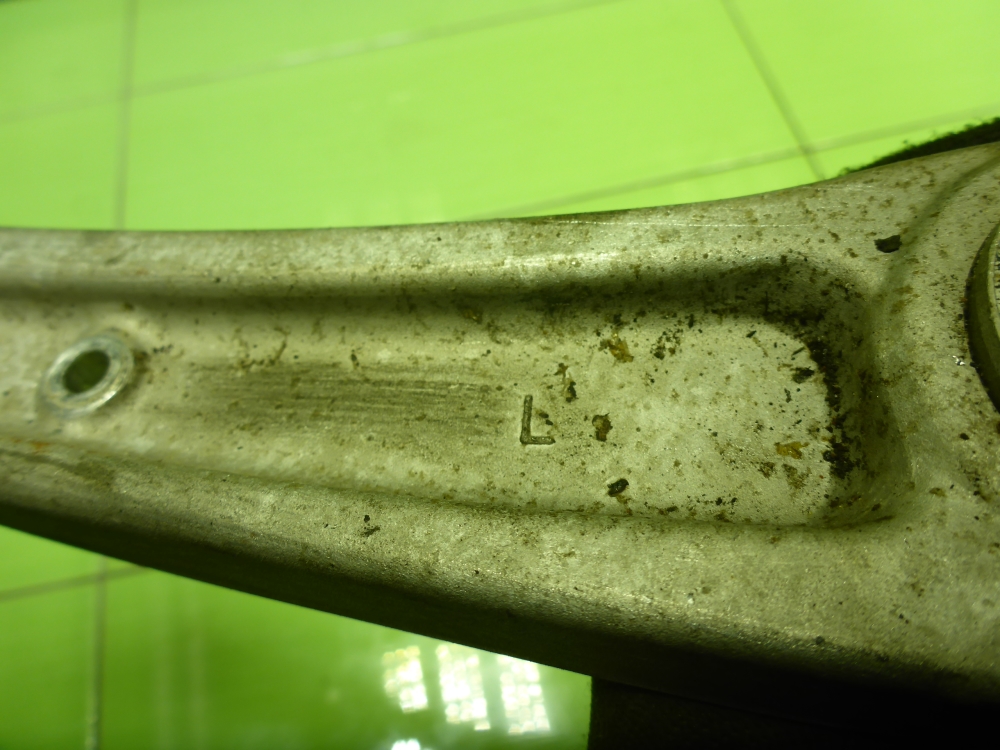 Рычаг передний нижний левый