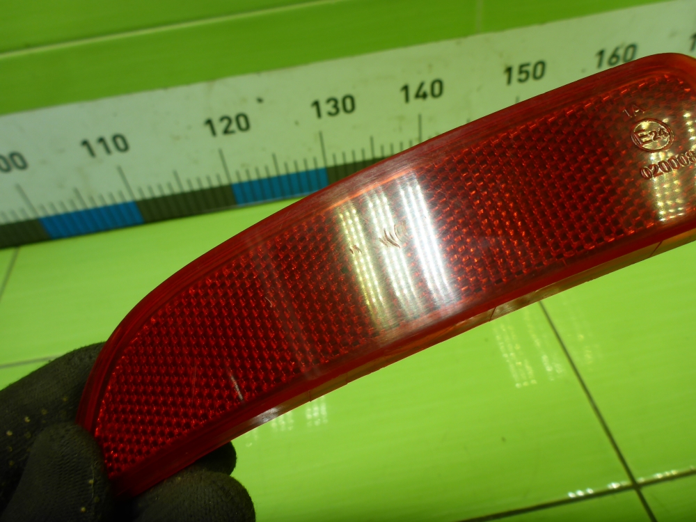 Отражатель в бампер задний левый