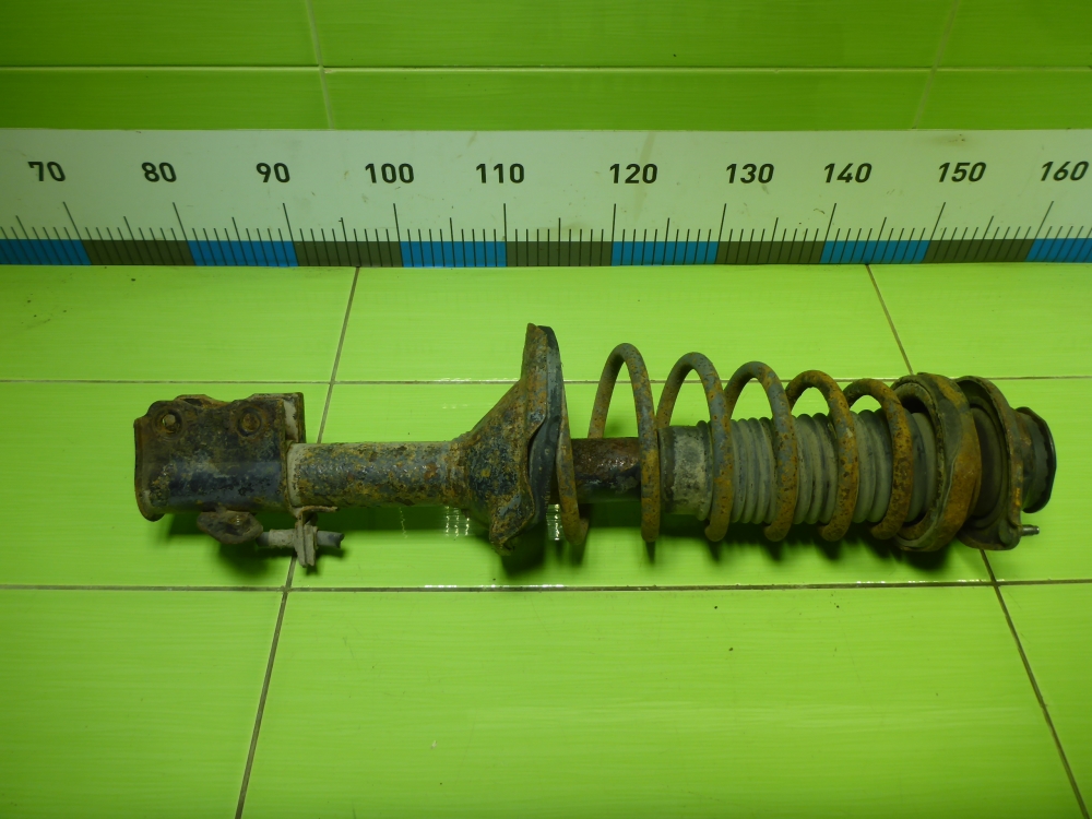 Амортизатор задний левый