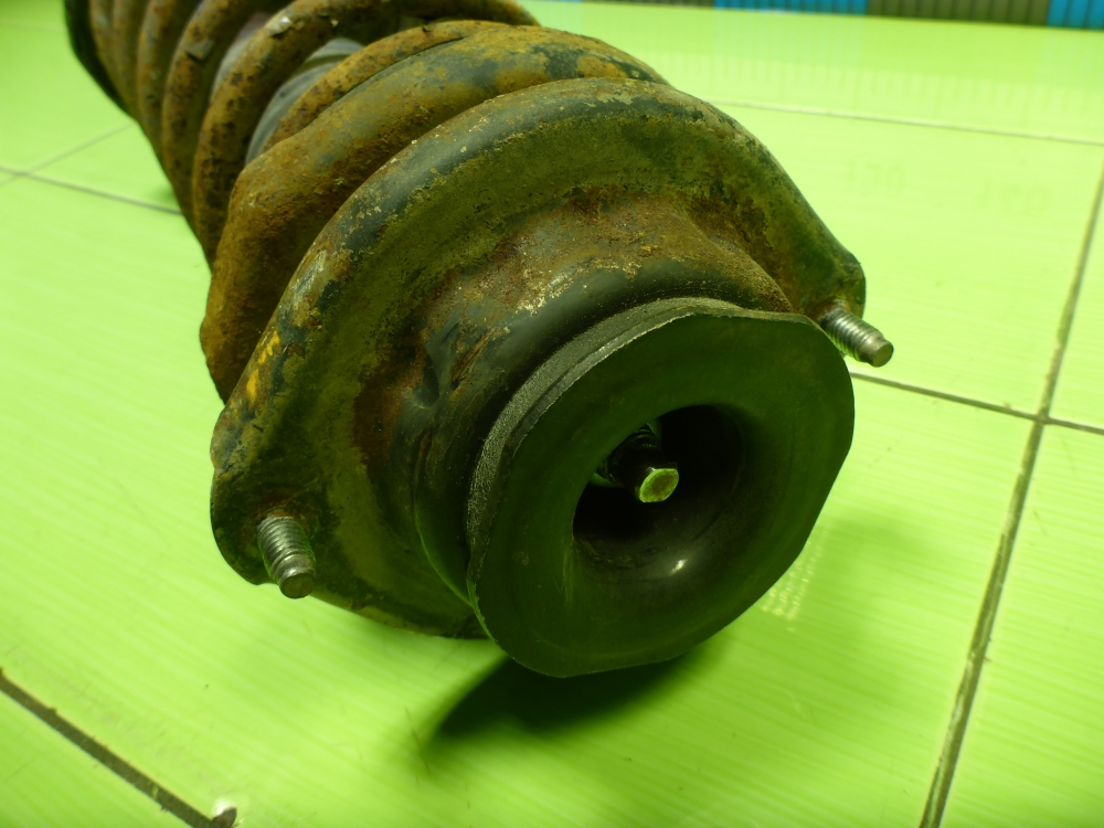 Амортизатор задний левый