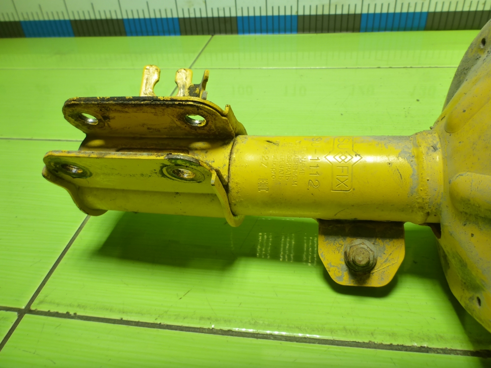 Амортизатор передний левый