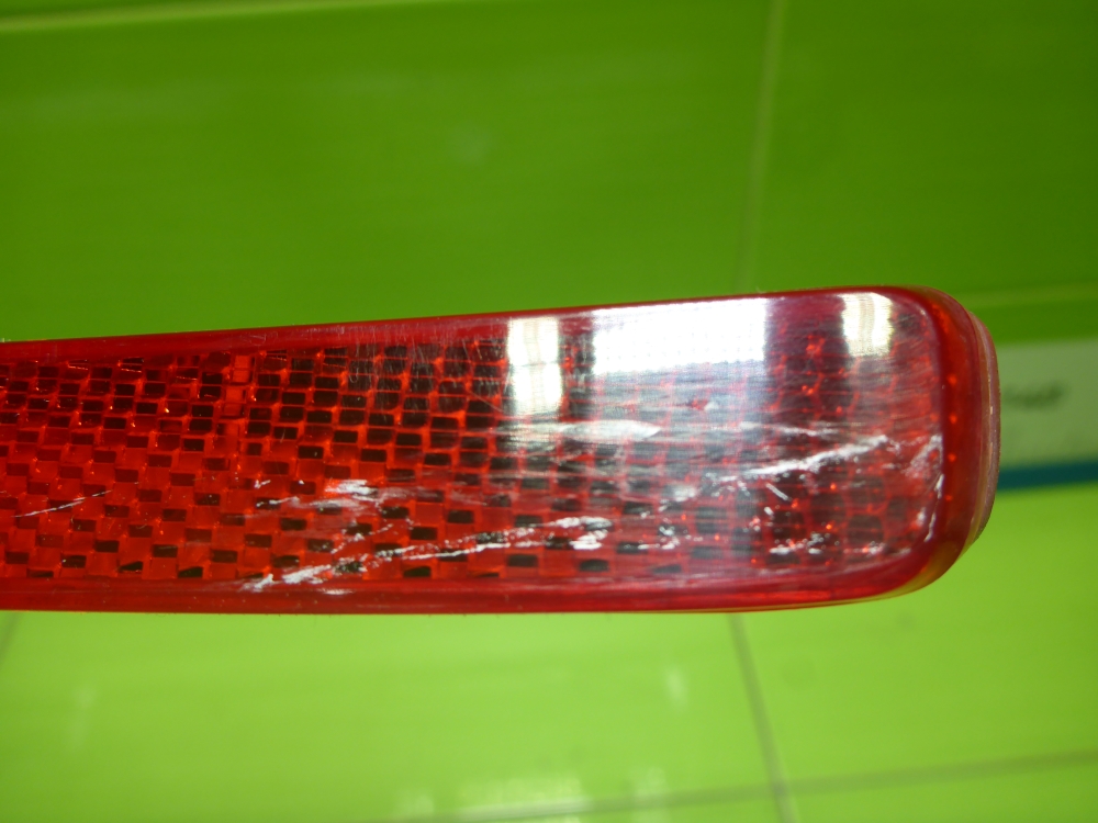 Отражатель в бампер задний левый