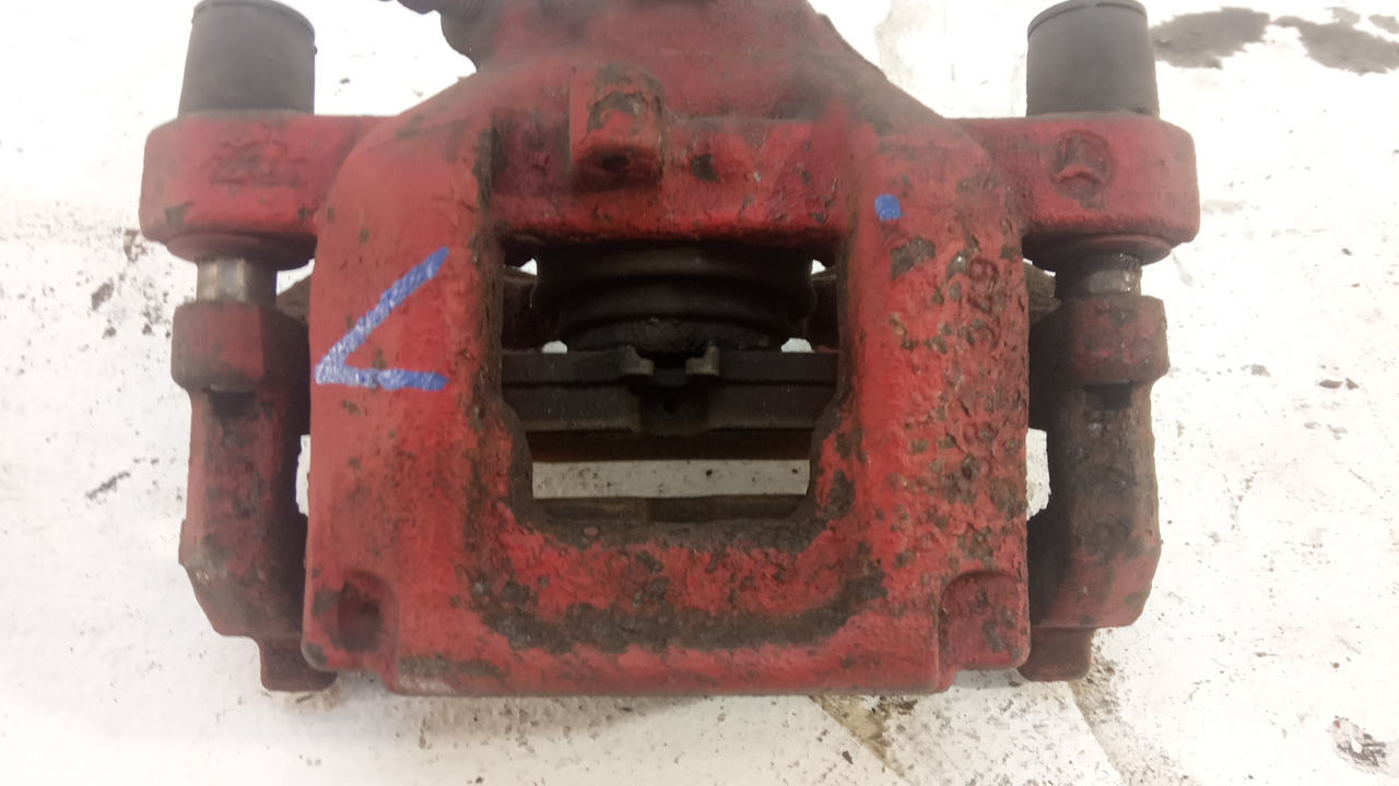 Суппорт задний левый