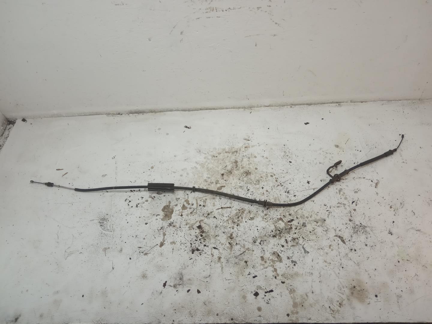 Трос стояночного тормоза левый