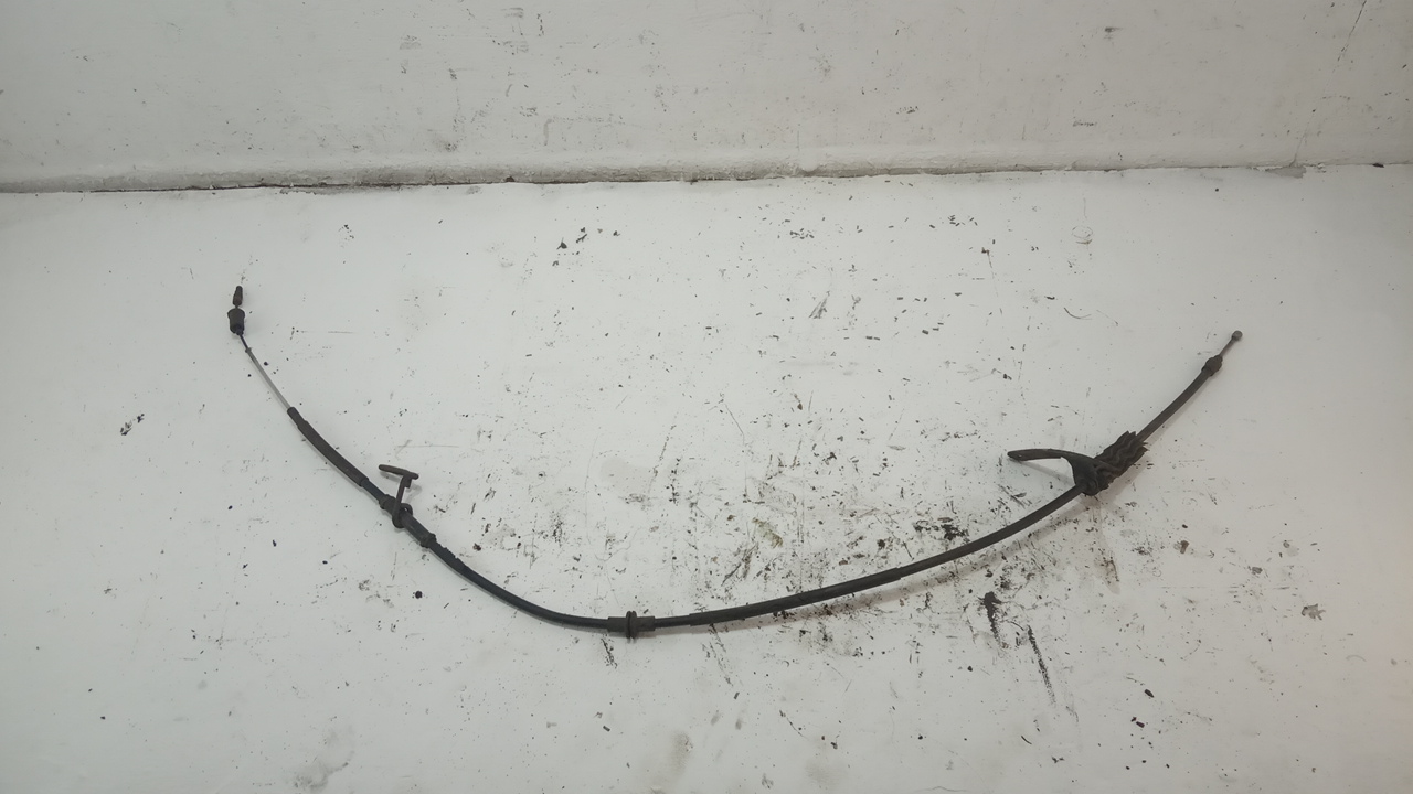 Трос стояночного тормоза левый