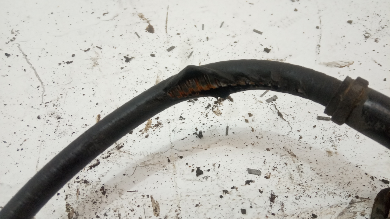 Трос стояночного тормоза левый