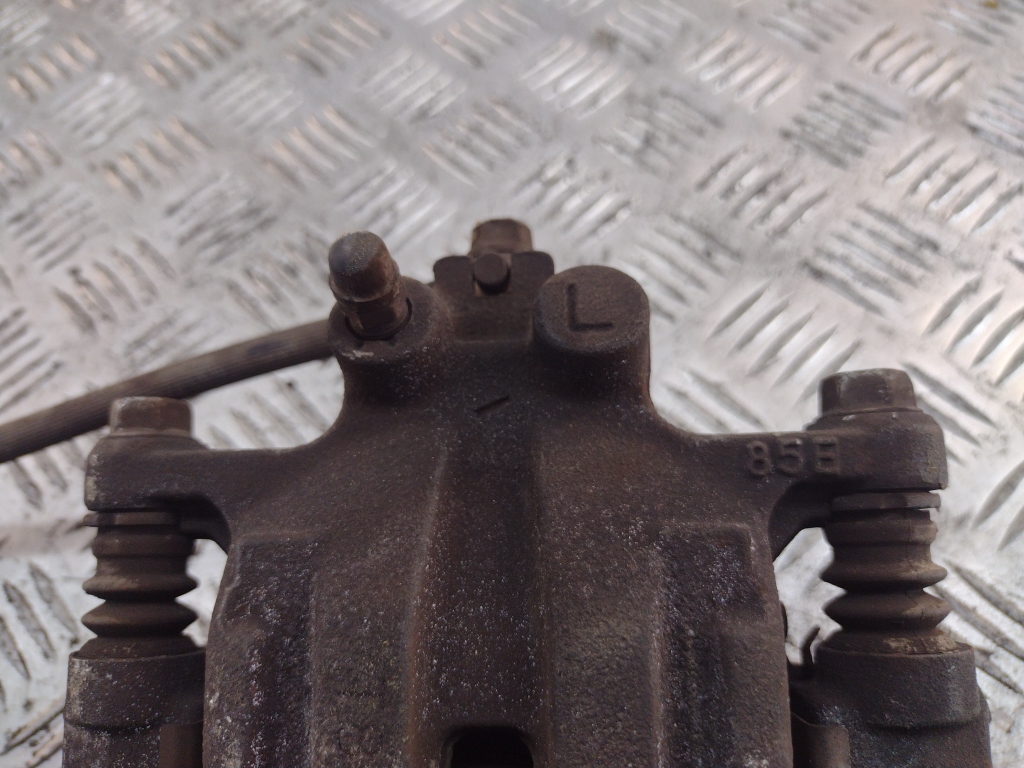 Суппорт задний левый