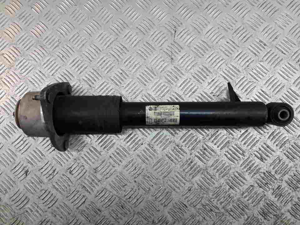 Амортизатор задний левый