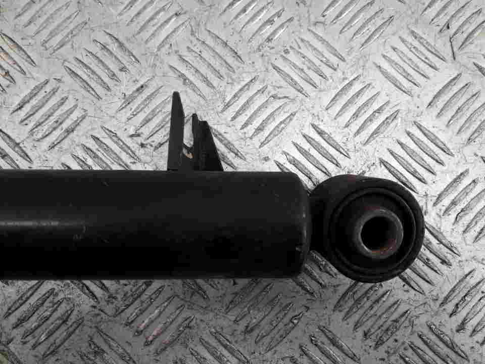 Амортизатор задний левый