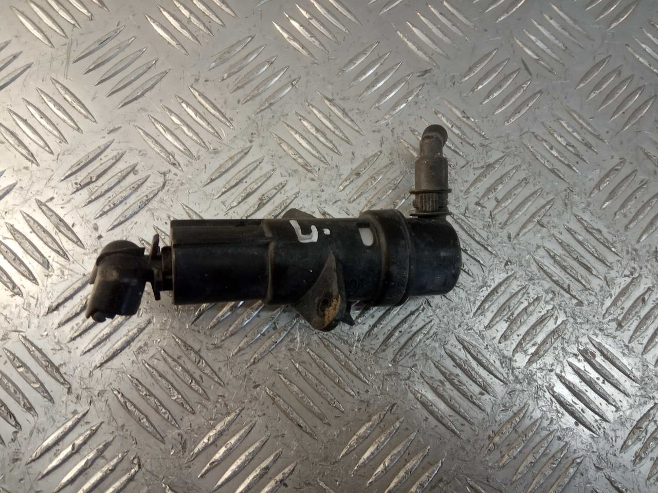 Форсунка омывателя фары