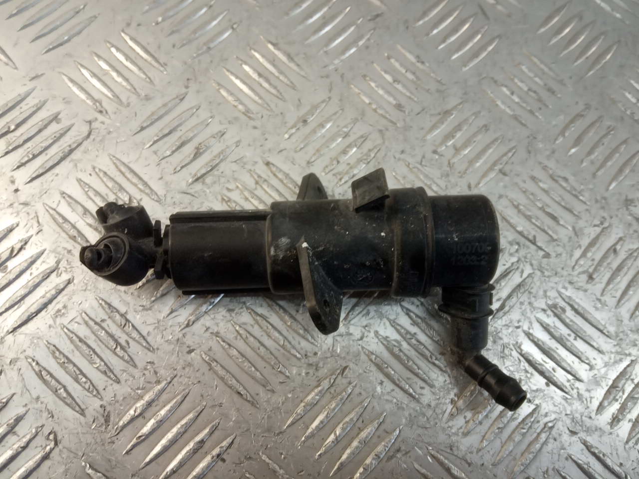 Форсунка омывателя фары