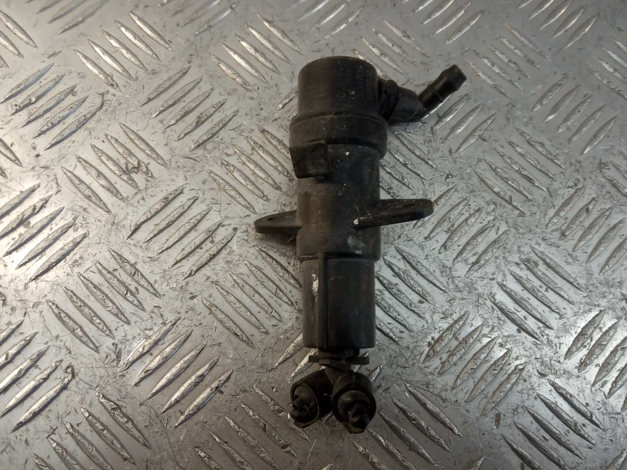 Форсунка омывателя фары