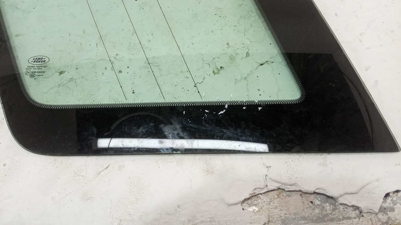 Стекло кузовное глухое левое