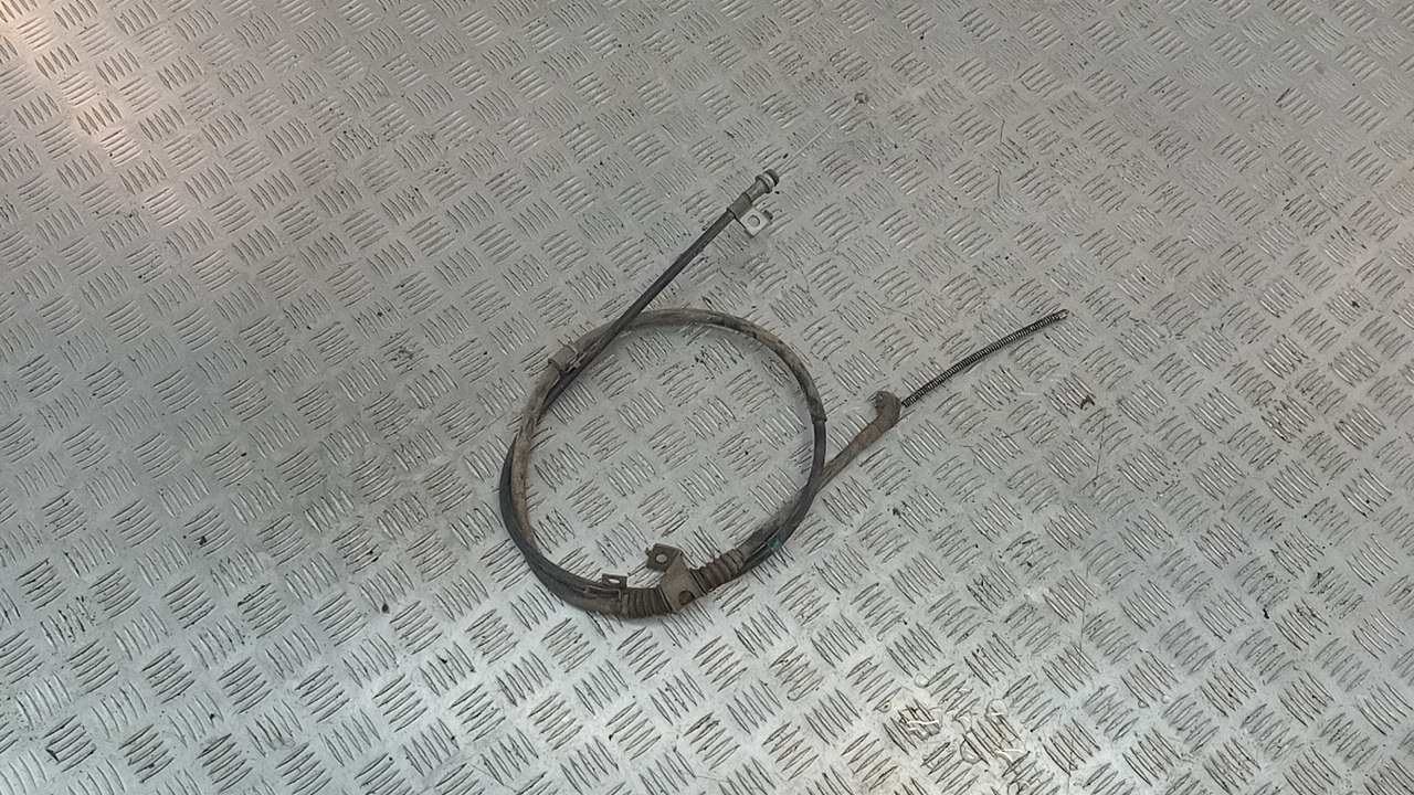 Трос стояночного тормоза левый