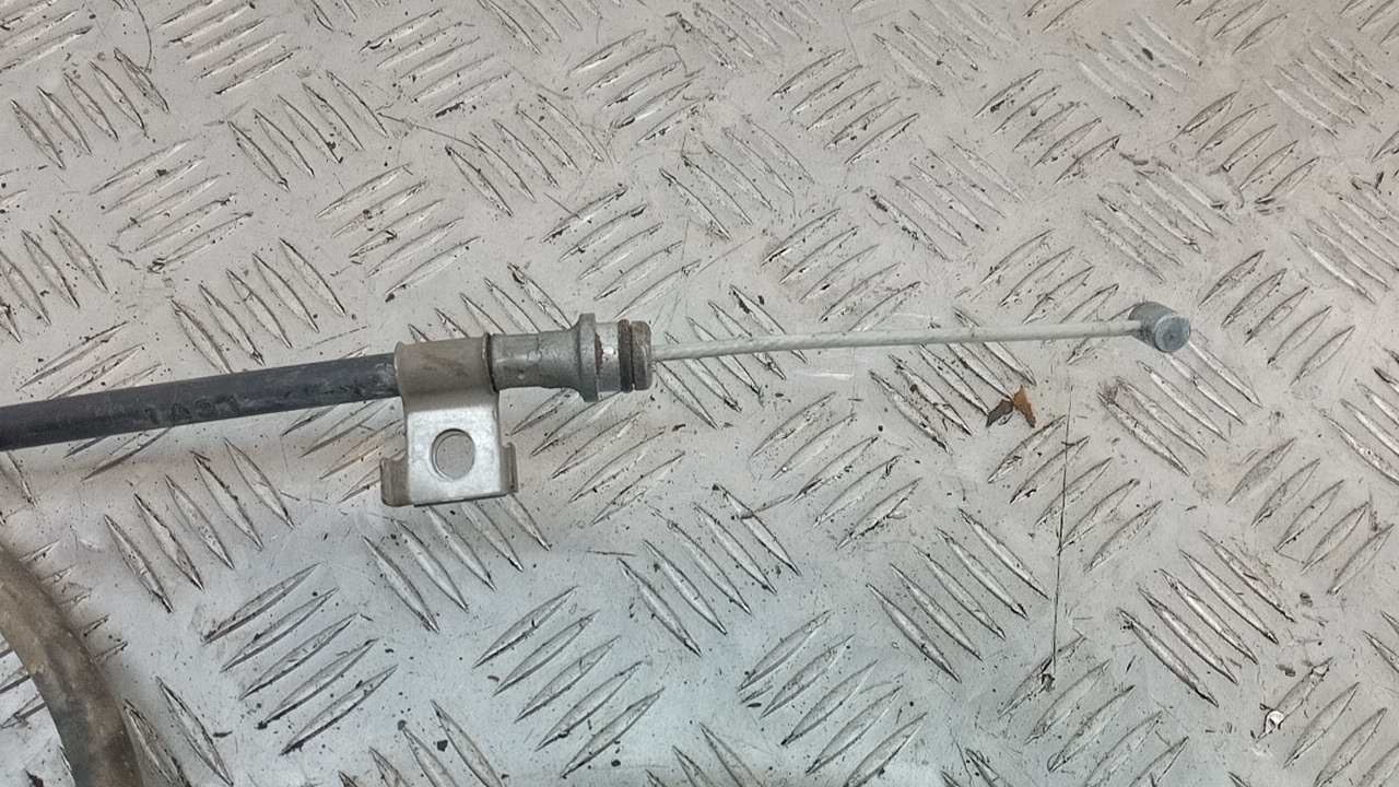 Трос стояночного тормоза левый