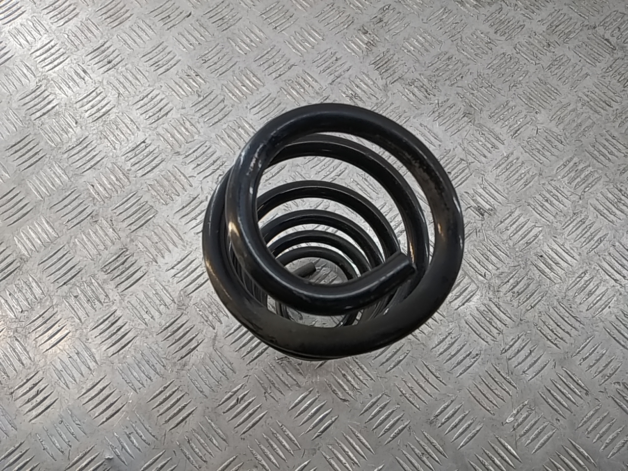 Пружина задняя