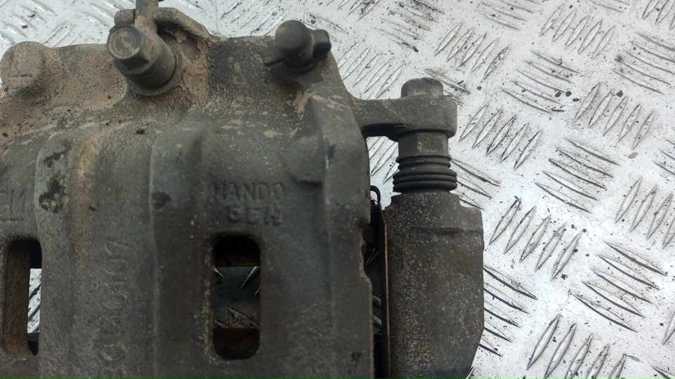 Суппорт передний левый