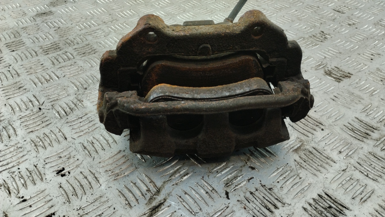 Суппорт передний левый